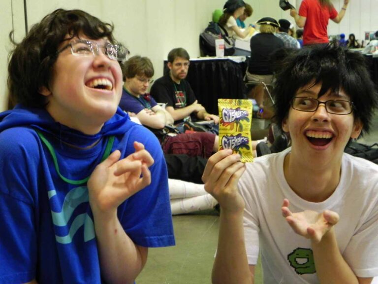 Wearing the completed costume, holding up a pack of Gushers.