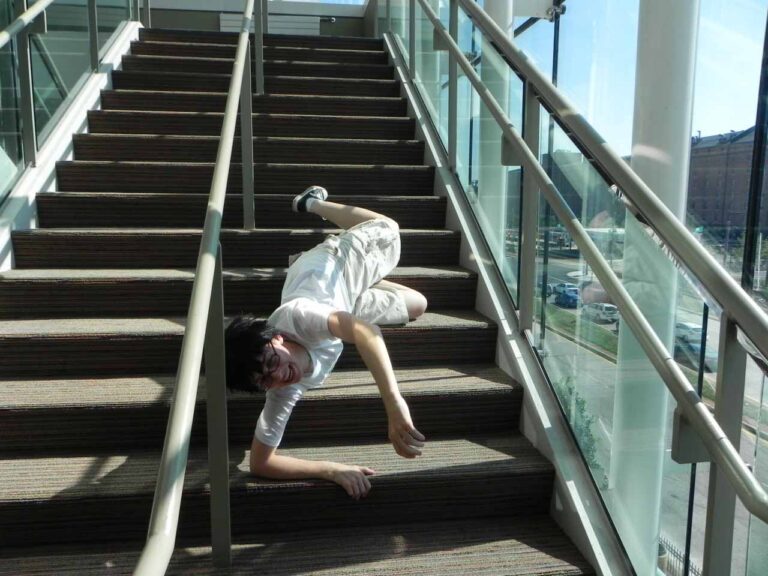 Wearing the completed costume, pretending to fall down a flight of stairs.