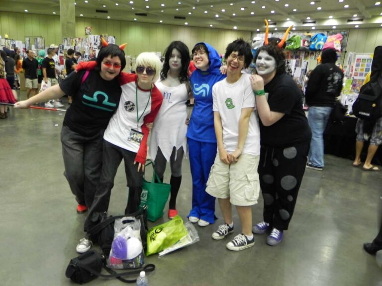 Posing in costume with a group of other cosplayers.