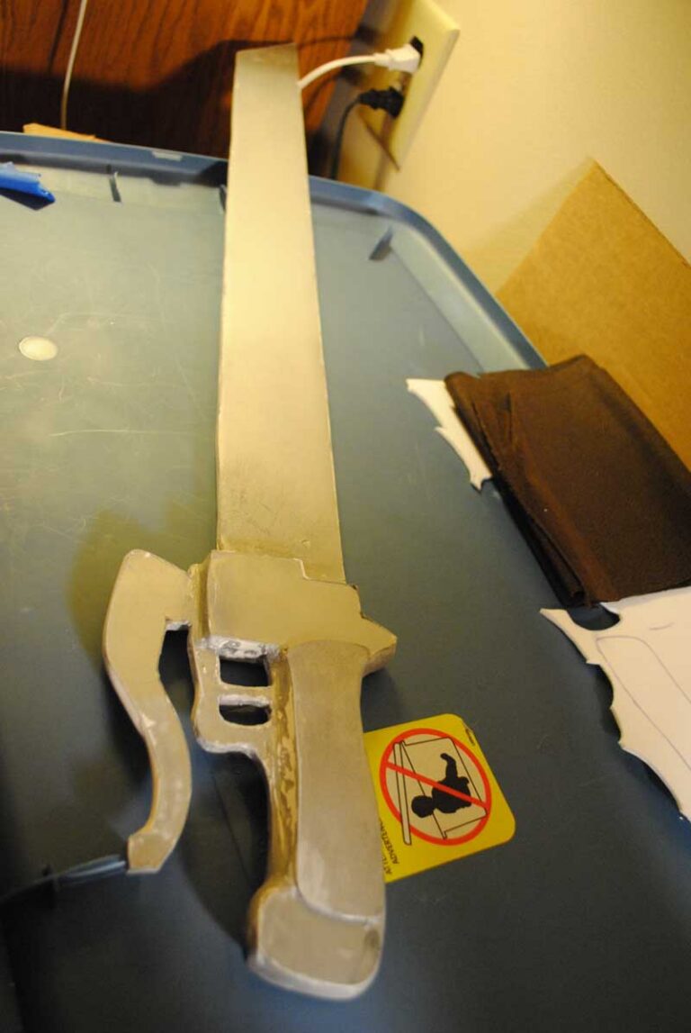 One of the swords, primed and ready for the next coat of paint.