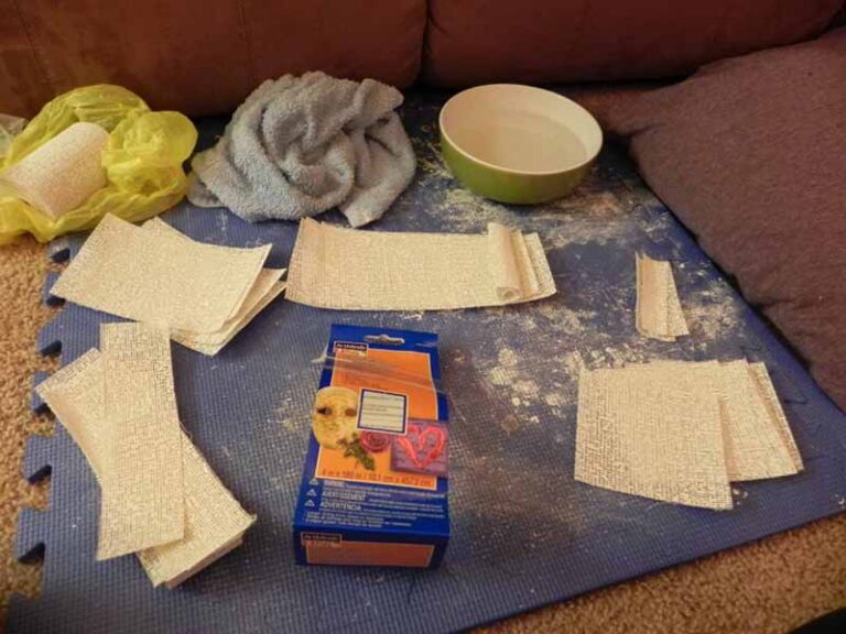Plaster bandage supplies laid out, ready to cast a mold of the face.