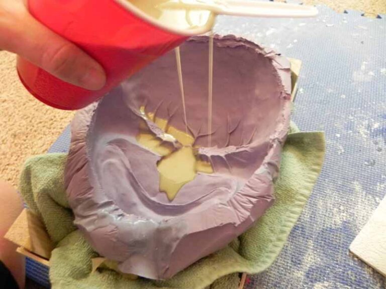 Pouring resin into the silicone mold.