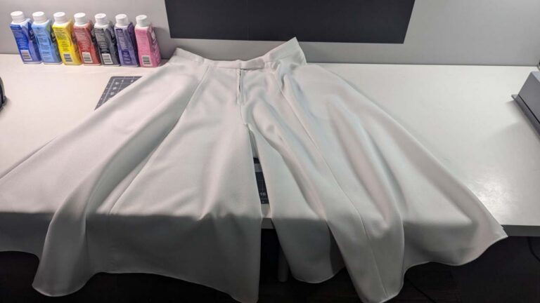 Large, loose pants cut and sewn from white flowy fabric.