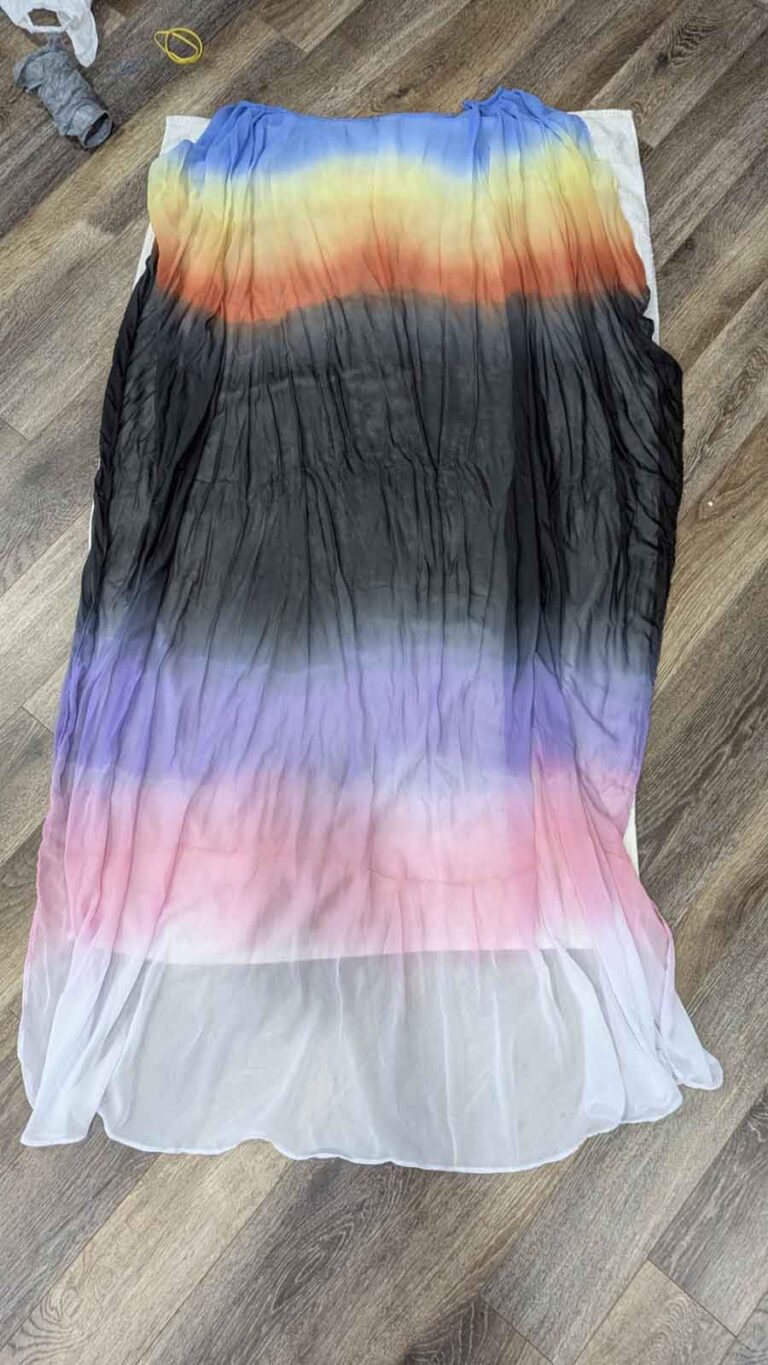 The long chiffon cape, drying after completing the final dye to add black.