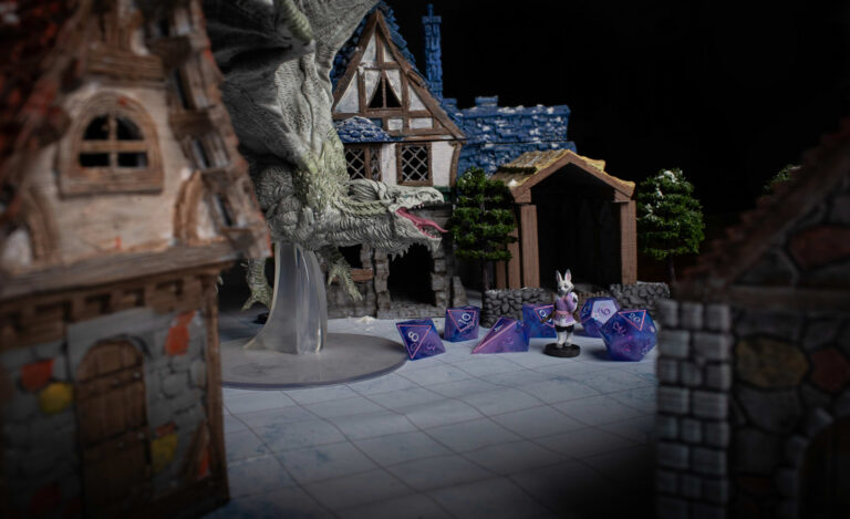 A set of purple and pink D&D dice with a matching Harengon bunny miniature character, in front of a model scene of a large dragon in a village.