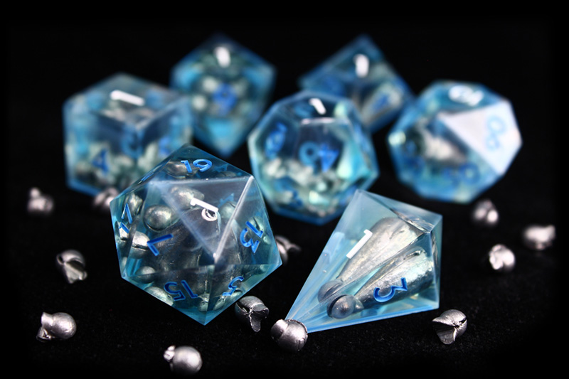 A set of translucent blue dice with lead fishing weights embedded.