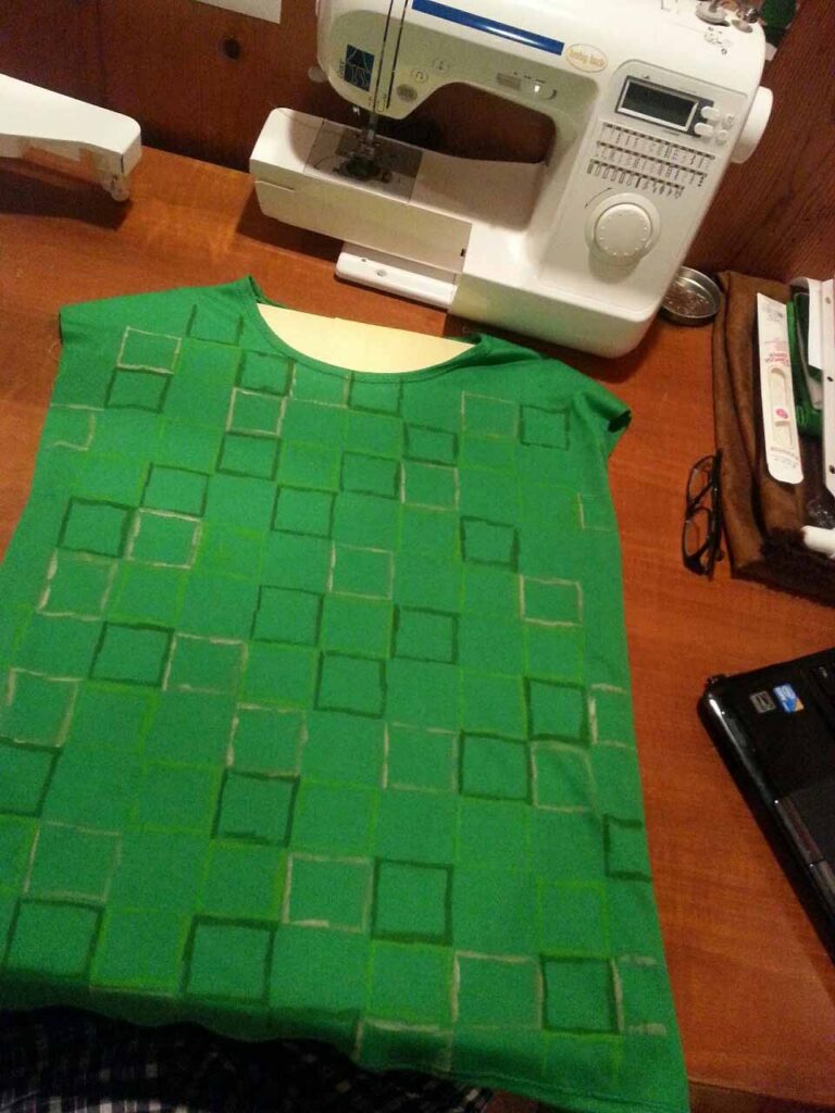 The shirt, with green squares hand-painted to mimic a pixel grid effect.