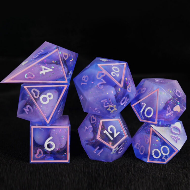 A set of pink and purple dice with glitters, stars, and hearts embedded.